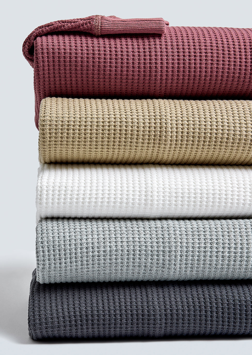 IMAGE OF MULTIPLE WADE THERMALS FOLDED AND STACKED ON TOP OF EACH OTHER