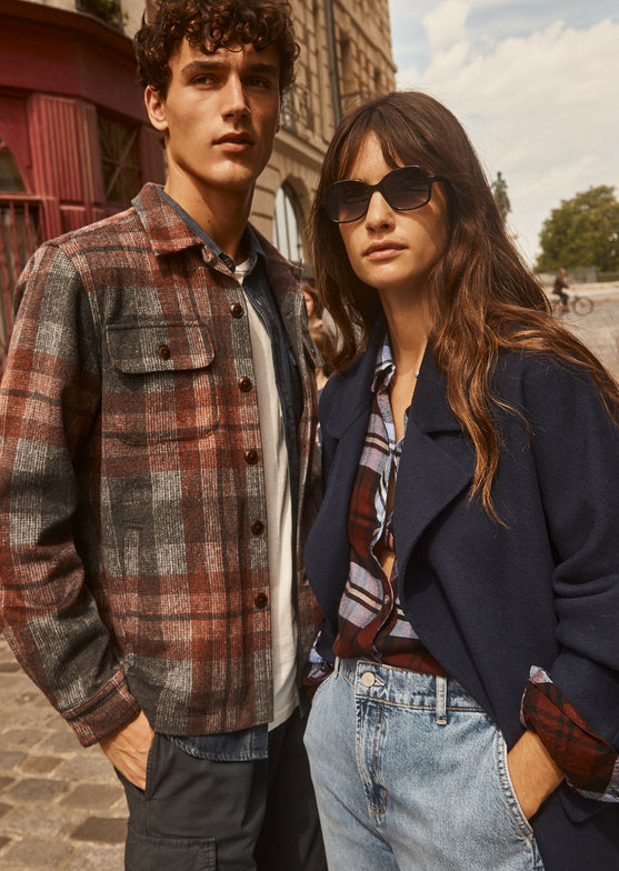 FRONT EDITORIAL IMAGE OF TWO MODELS. FIRST MODEL IS WEARING VIGGO SHIRT JACKET. SECOND MODEL IS WEARING MARTA COAT. 