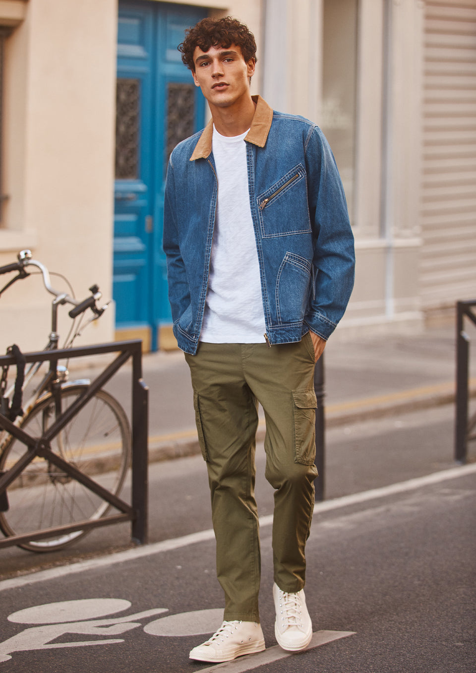 FULL BODY EDITORIAL IMAGE OF MODEL WEARING KETTER JACKET, SKIPPER T-SHIRT, AND EMMERSON PANT