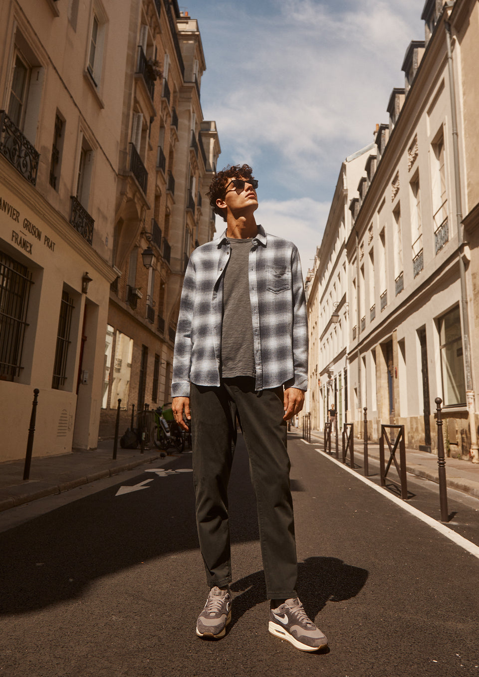 FRONT FULL BODY EDITORIAL IMAGE OF MODEL WEARING LENNOX SHIRT, SKIPPER T-SHIRT, AND JULIAN PANT