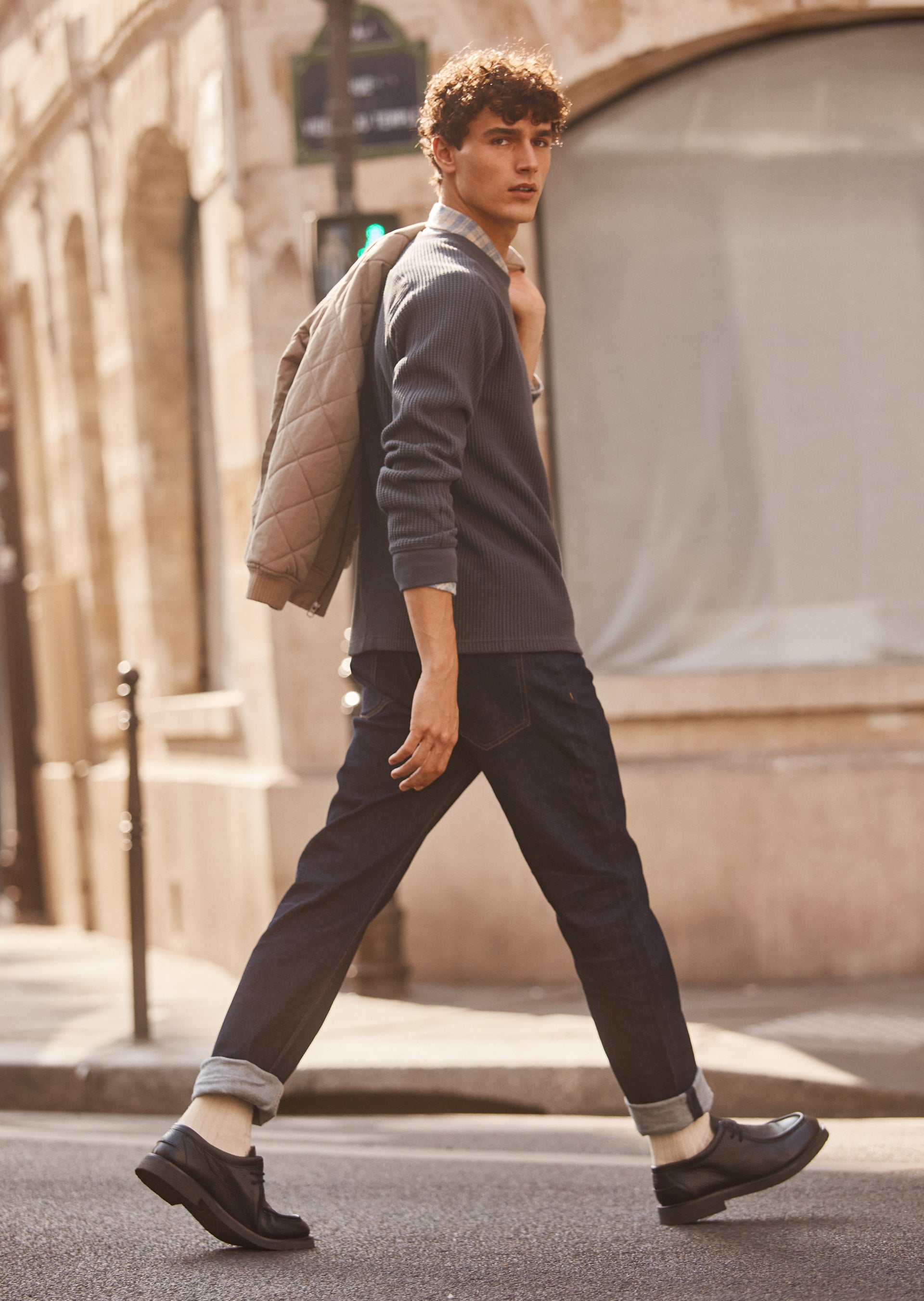 SIDE EDITORIAL IMAGE OF MODEL WEARING WADE THERMAL AND LENNOX SHIRT