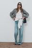 Blake Jacket in Crinkle Nylon Blend With Relaxed Fit, High Funnel Neck, Double Button Closures, Drop Shoulder Sleeves With Elastic Cuffs, and Cropped Drawstring Hem in Mini Check Colorway - Full Body Front View Featured on Model - Video