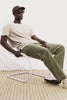 Decker Relaxed Straight Leg Workwear Pant in Stretch Cotton With Lived-In Wash, Zip Fly, and Side and Back Buttoned-Flap Pockets in Olive Colorway - Video - Full Body Front View Featured on Model
