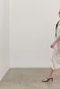 (Video): Monique Dress in Ivory shown on a model to showcase the Satin material of the Midi Dress. Full Body View Featured on Model.