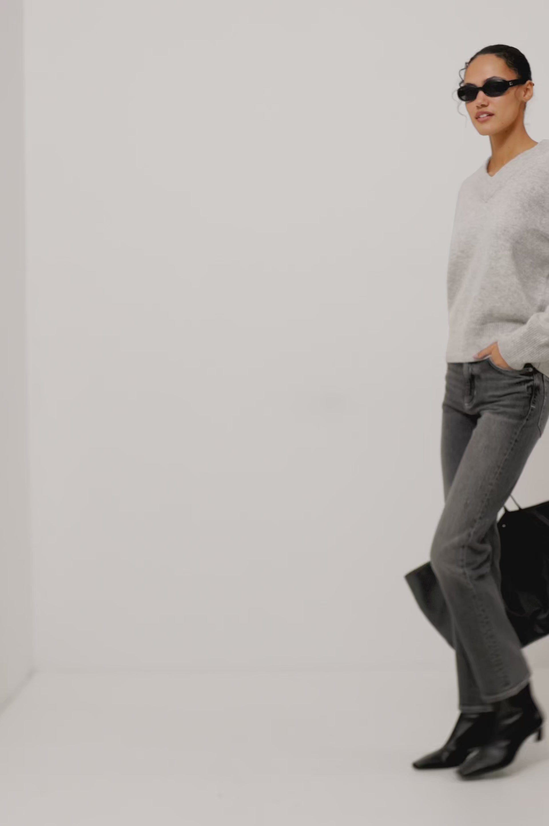 Lidya Sweater in Wool-Cashmere Knit Blend With V-Neckline, Loose Relaxed Fit, Long Sleeves, and Ribbed Trim in Heather Grey Colorway - Full Body Front View Featured on Model - Video