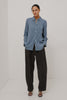 Beck Shirt in Luxe Rayon With Collar, Button Front, Chest Patch Pocket, Long Sleeves, and Relaxed Fit in Washed Indigo Stripe Colorway - Upper Body Front View Featured on Model - Video