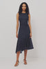 Daija Midi Dress in Self-Lined Mesh With High Neckline, Fitted Bodice, Side Waist Ruching, Bias Cut Skirt, and Asymmetric Hem in Chocolate Polka Dot Colorway - Full Body Side View Featured on Model - Video
