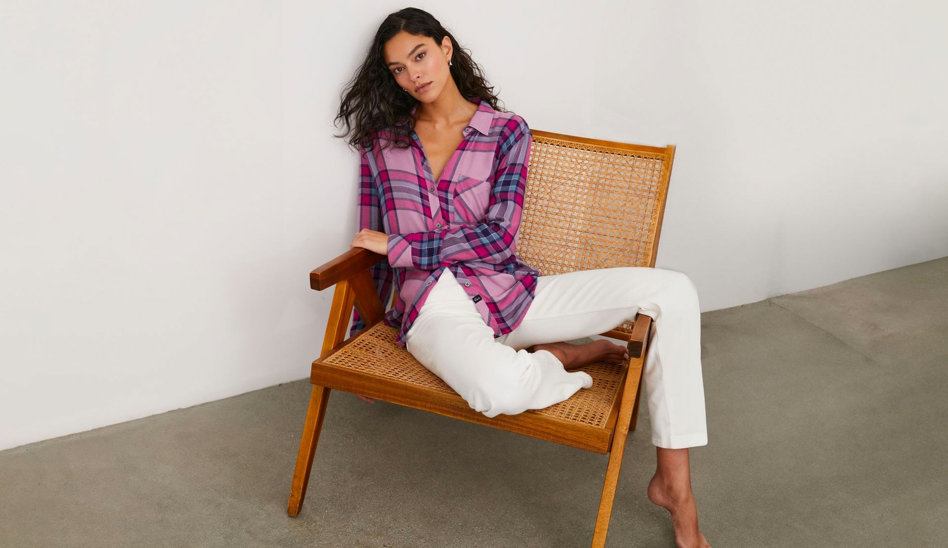 FRONT EDITORIAL IMAGE OF MODEL SITTING WEARING HUNTER SHIRT