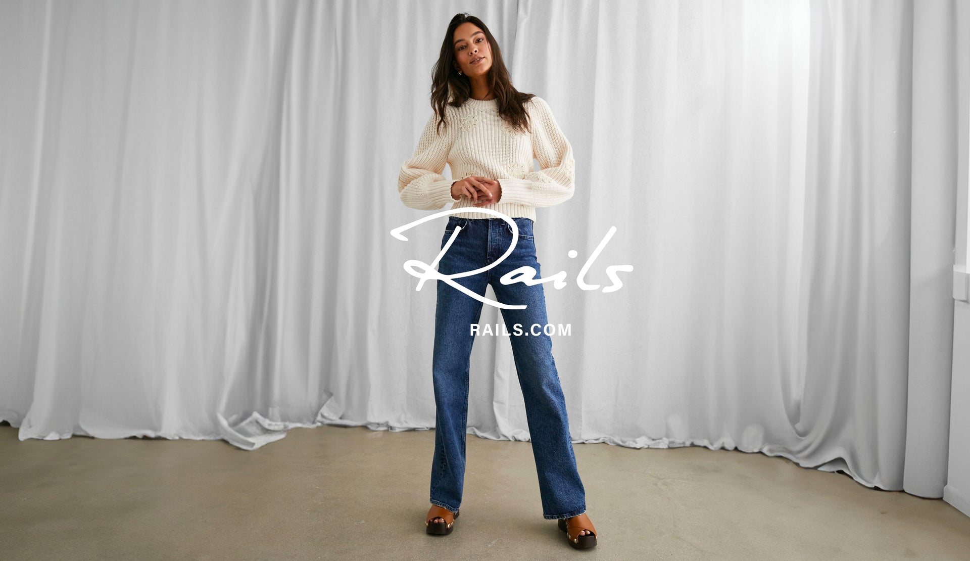 FRONT FULL BODY IMAGE OF MODEL WEARING ROMY SWEATER AND GETTY WIDE LEG JEANS