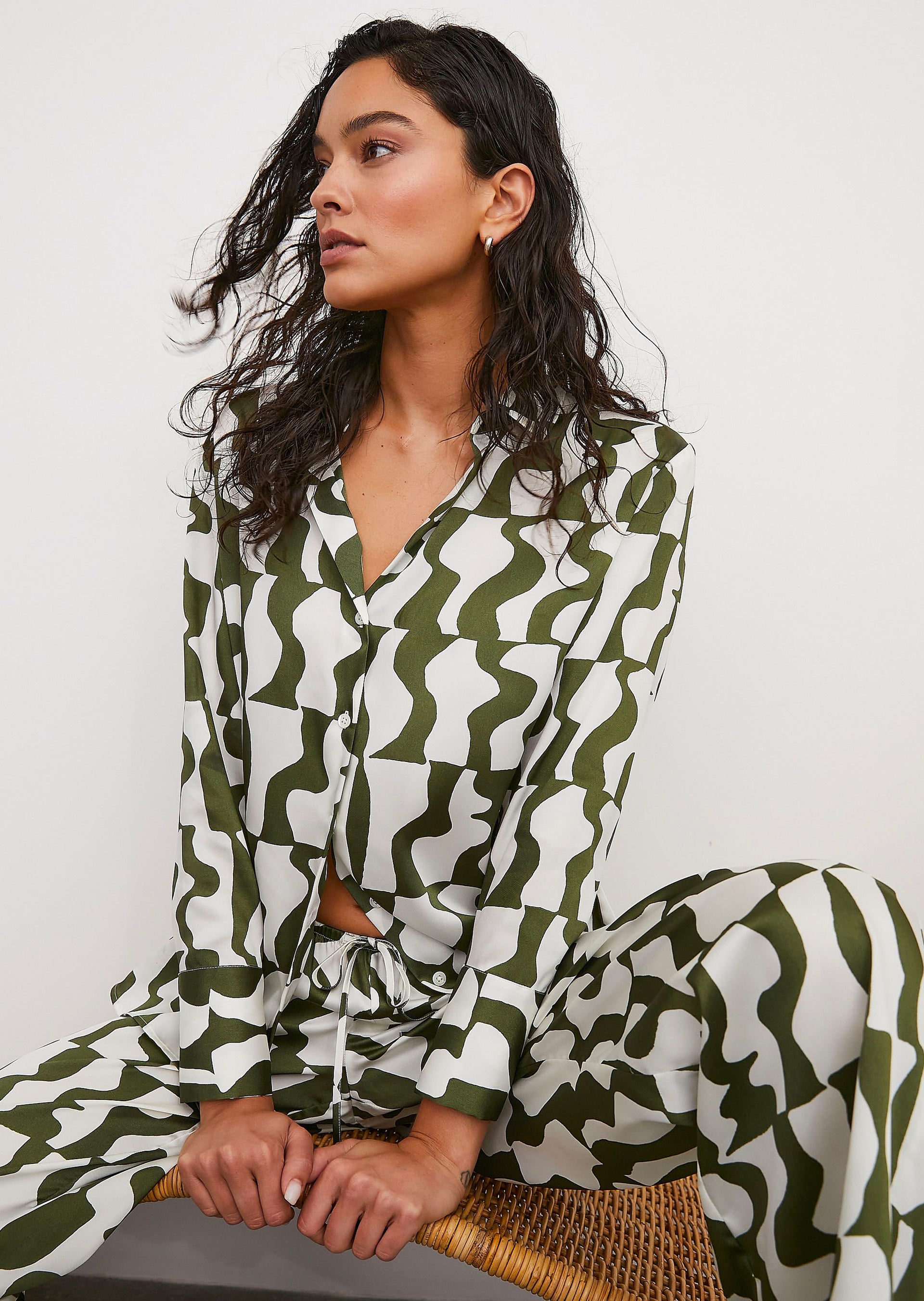 FRONT EDITORIAL IMAGE OF MODEL SITTING WEARING LEDGER SHIRT AND DAMANI PANT