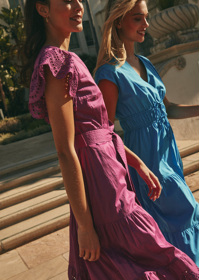Side editorial image of two models wearing Gia Dress and Lucia Dress