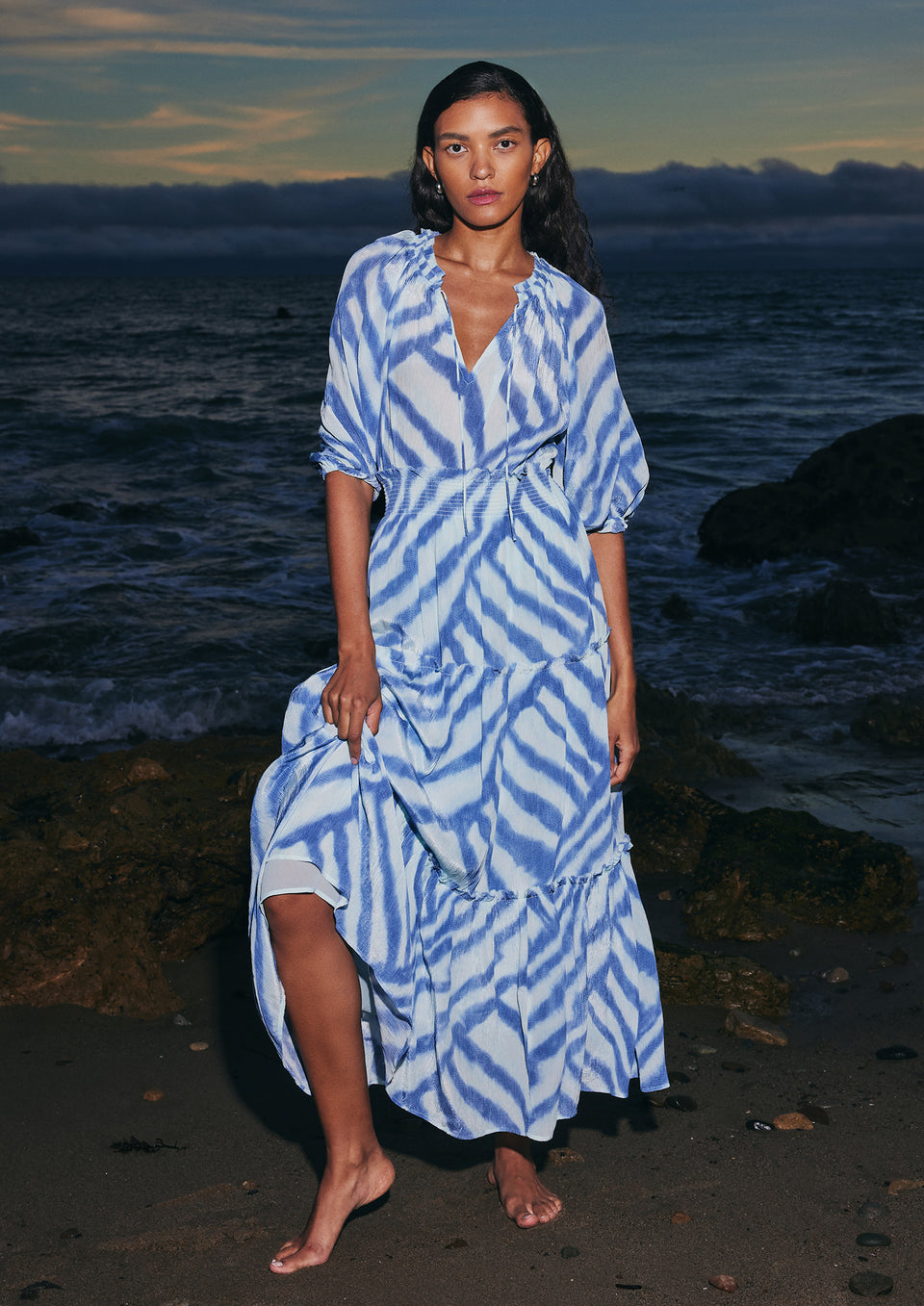 FRONT FULL BODY EDITORIAL IMAGE OF MODEL WEARING CATERINE DRESS IN BLUE WATERCOLOR STRIPES