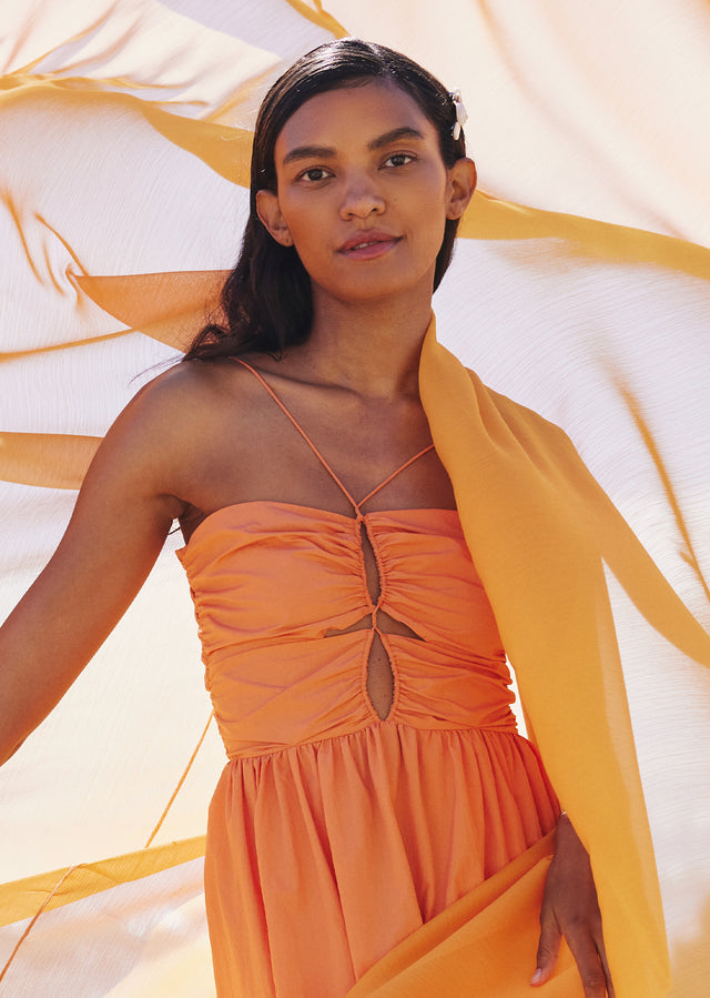 FRONT EDITORIAL DETAIL IMAGE OF THE TOP OF THE SILVIA DRESS IN PAPAYA