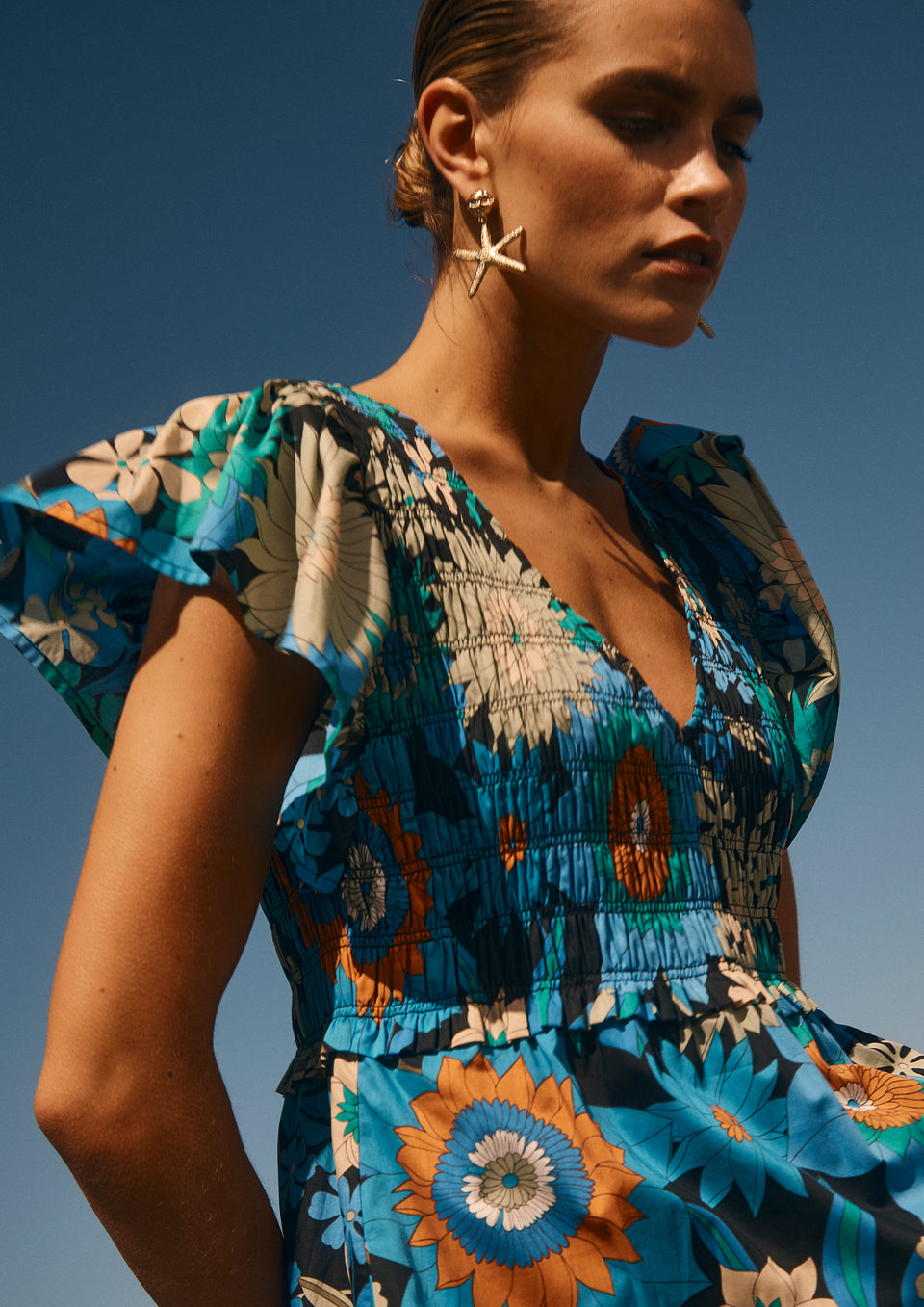 Side editorial image of model wearing Clementine Dress