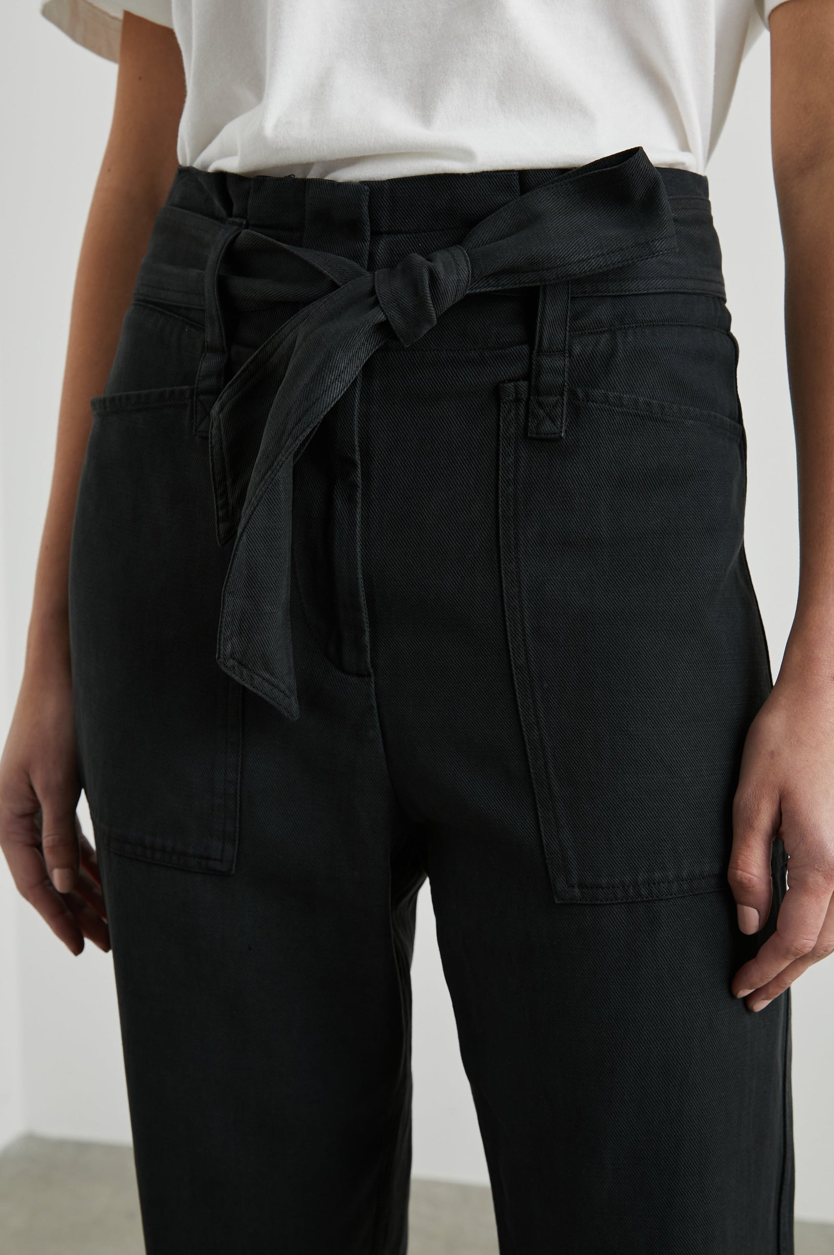 Achilles Pants with Fabric Tie Belt, Two Large Front Pockets, Two Back Patch Pockets and Belt Loops in Washed Black Colorway - Front View Featured on Model 