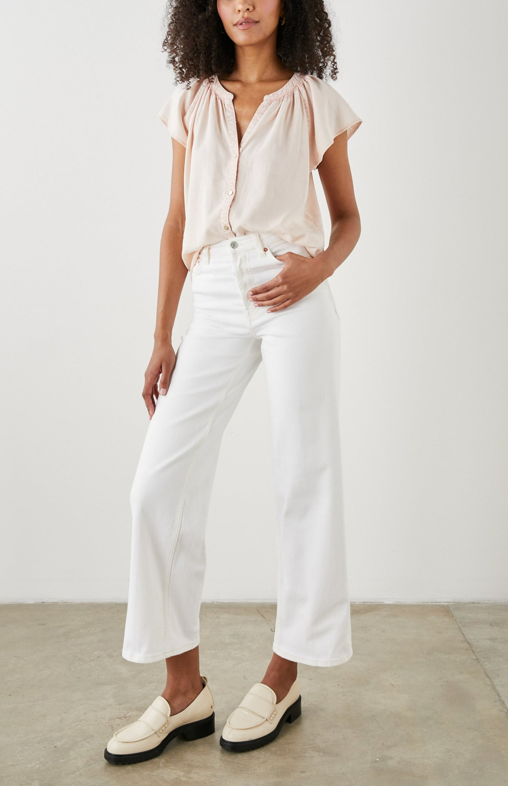 Alena Short Sleeve Top with Flutter Sleeves, a V Neck, Buttons Down the Bodice and Ruching along the Collar in Petal Colorway - Front Full Body View Featured on Model