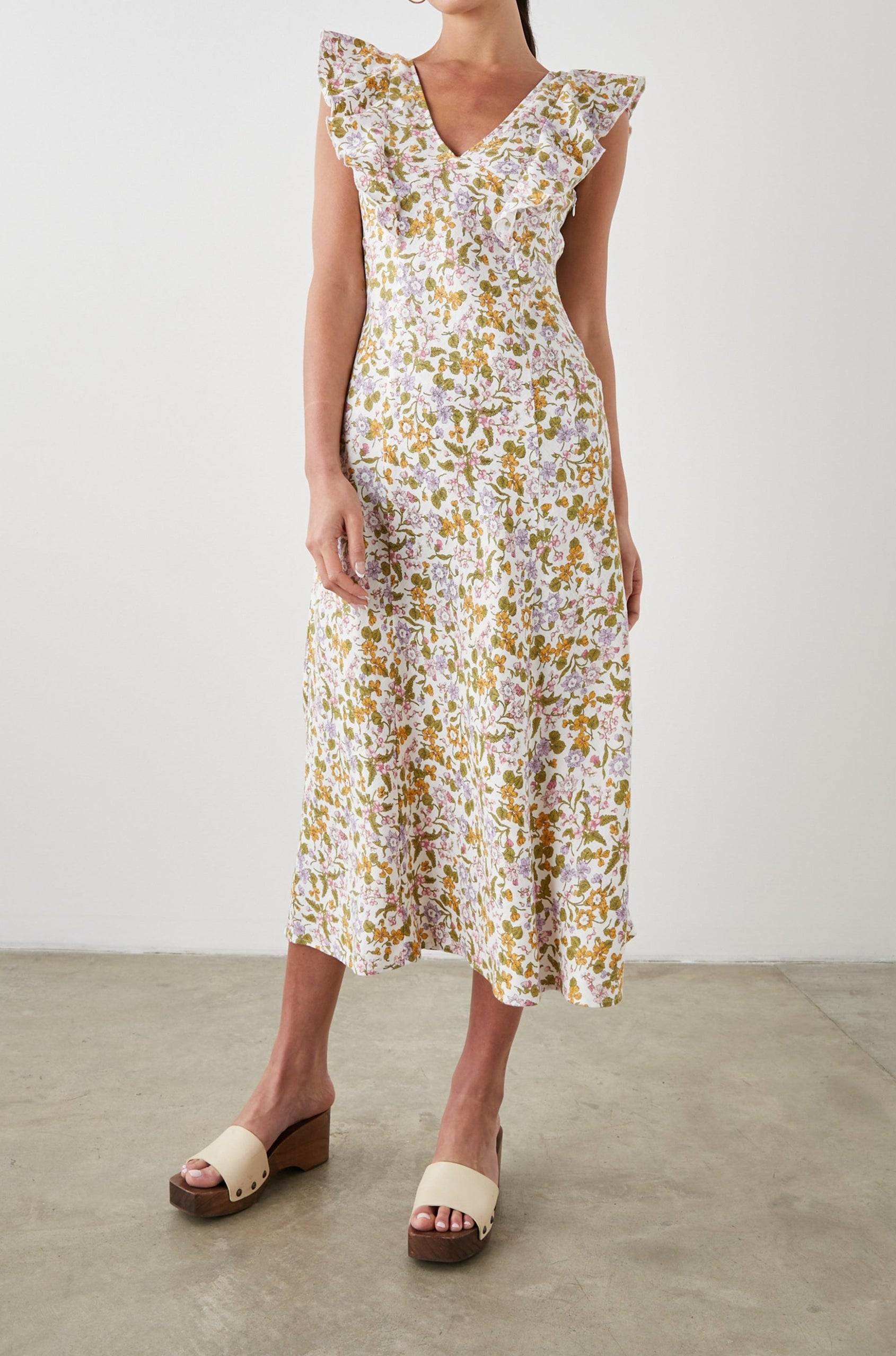 Constance Short Sleeve Midi Dress with Flutter Sleeves, a V Neck, and Cross Ties Across the Mid to Upper Back in Tansy Colorway, Brown, Orange, Purple, Pink and Green on White - Front Full Body View Featured on Model 