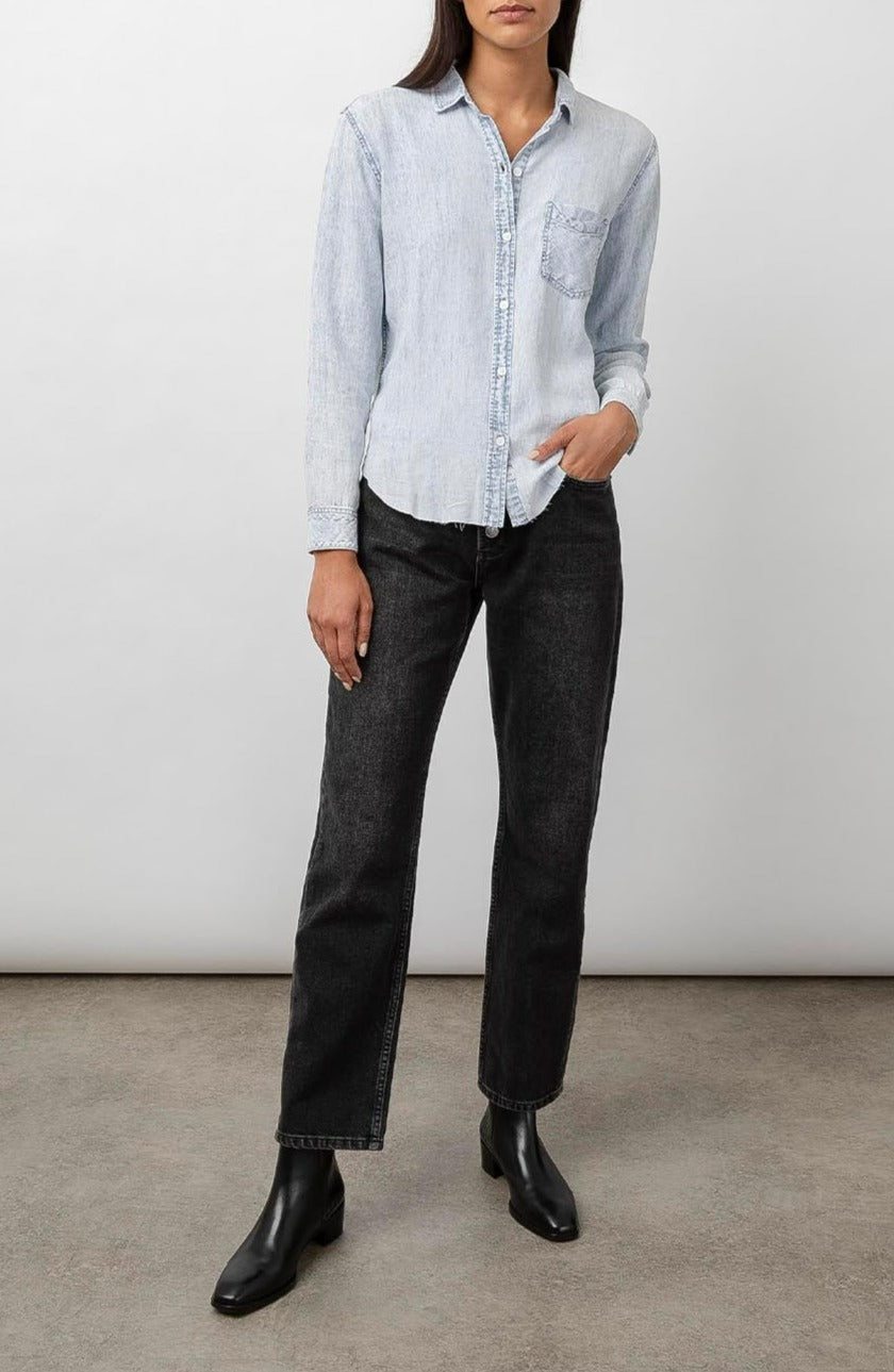 Ingrid Raw Hem, Long Sleeve Denim Button Up with a Chest Patch Pocket in Light Acid Wash Colorway - Front Full Body View Featured on Model
