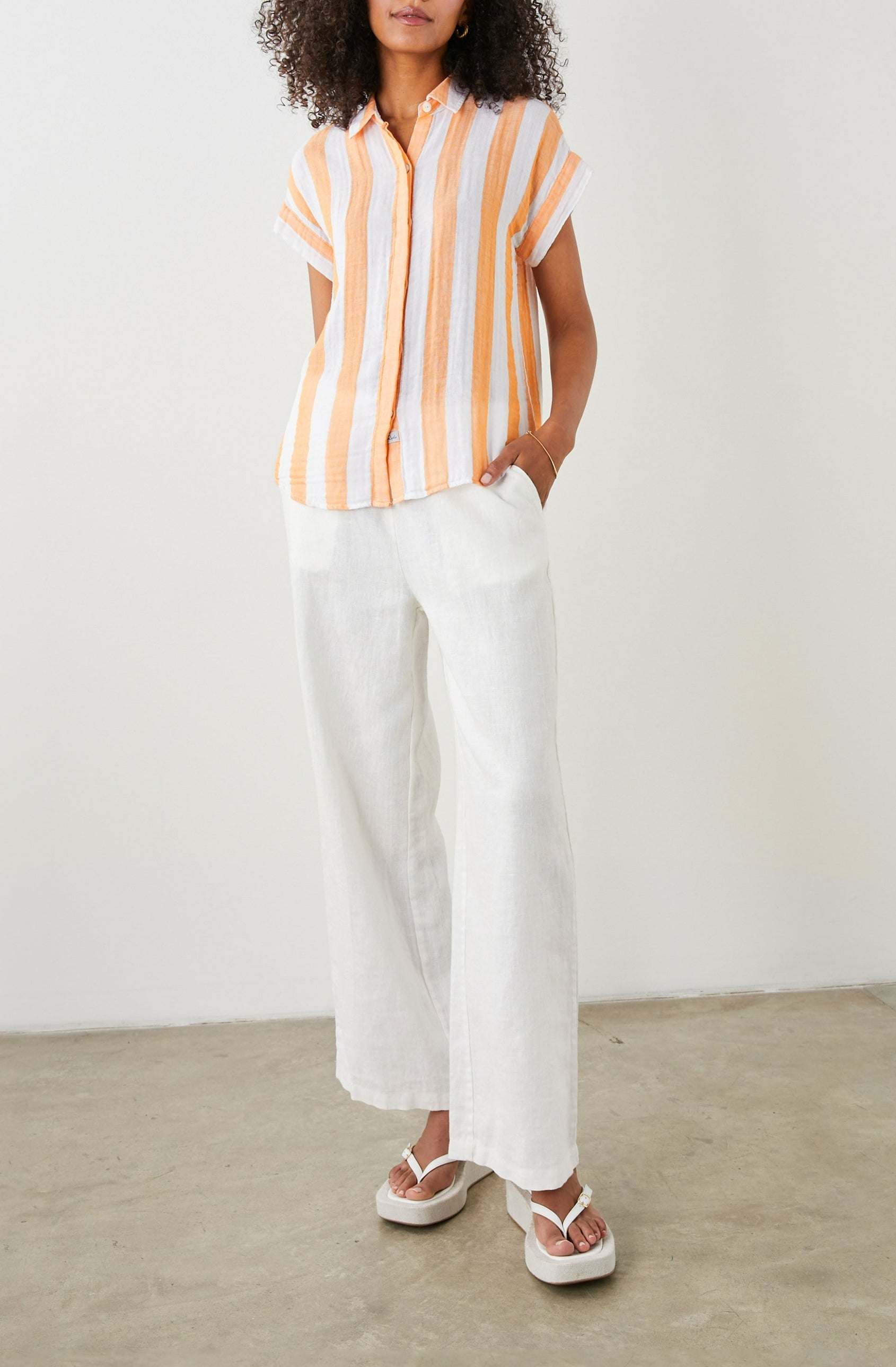 Jamie Short Sleeve Button Up in Ortona Stripe Colorway, Orange and White Vertical Stripes - Front Full Body View Featured on Model 