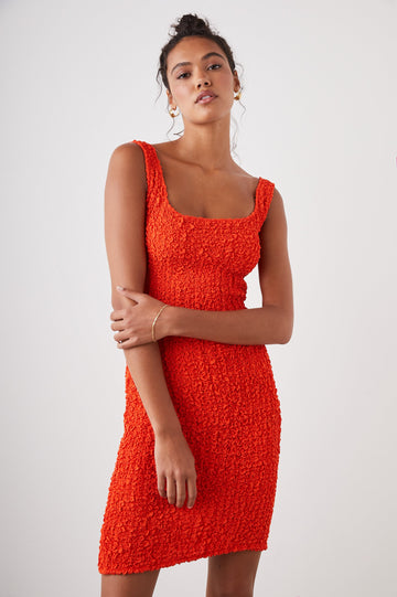 Julie Sleeveless Mini Dress with a Square Neck, Shoulder Straps and Textured Fabric in Cherry Colorway - Front View Featured on Model 