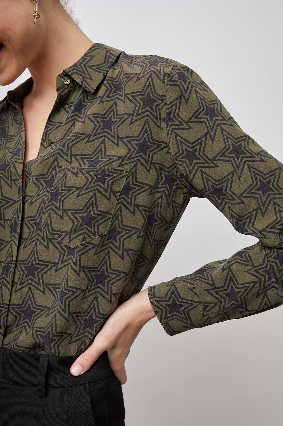 Kate Long Sleeve Button up with a Chest Patch Pocket in Olive Stargaze Colorway, Black Stars on Olive  - Front Tucked View Featured on Model