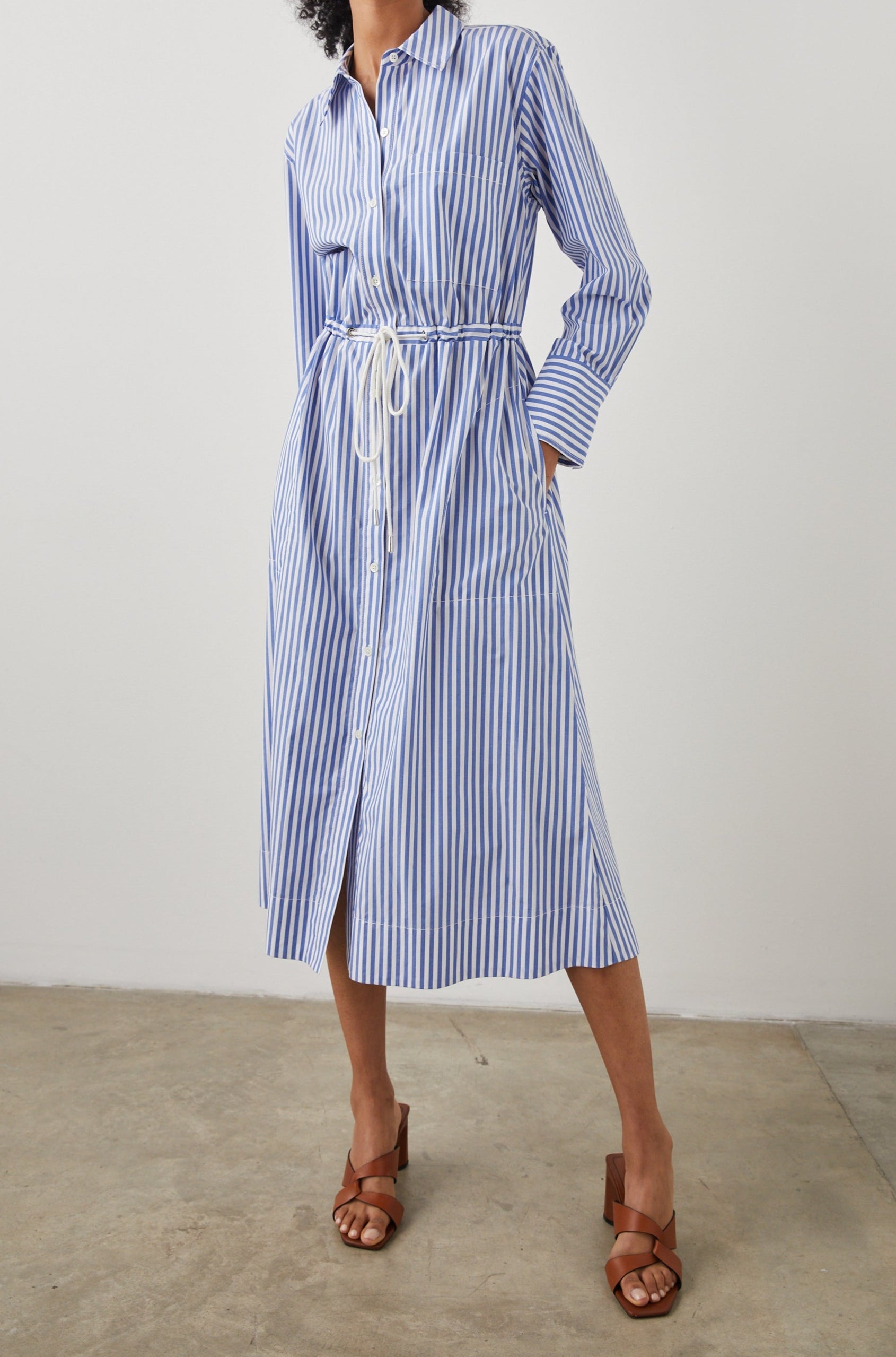 Shivonne Long-Sleeve Midi Dress with a Full Button Front, a Collar and a Drawcord Waist in Rivera Stripe Colorway, Blue and White Vertical Stripes - Front Full Body View Featured on Model