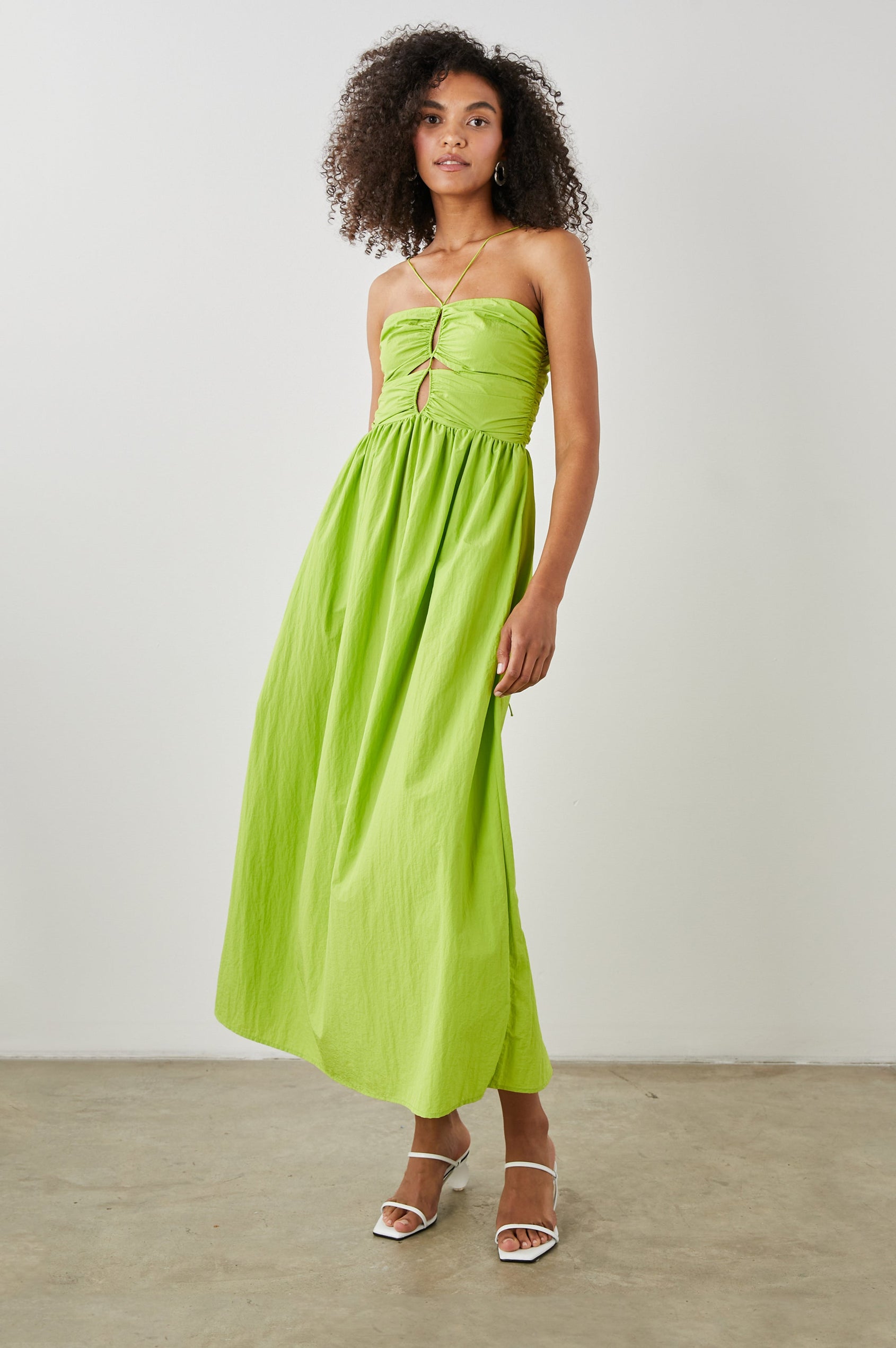 Silvia Sleeveless Maxi Dress with Spaghetti Straps with a Lower Back Tie, an Open Back, and Cutouts Along the Center of the Bodice in Banana Leaf Colorway - Front Full Body View Featured on Model