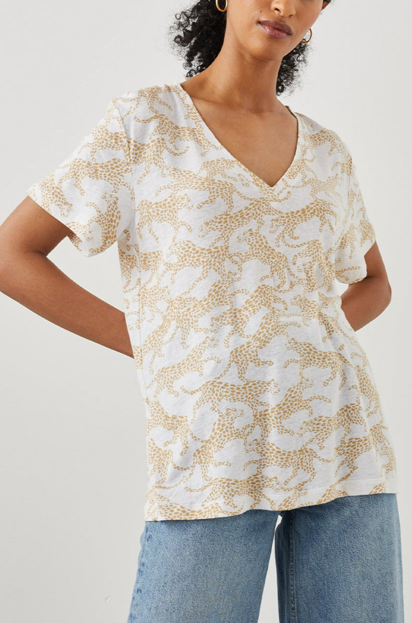 THE CARA V NECK SHIRT GOLD CHEETAH -FRONT IN MOTION