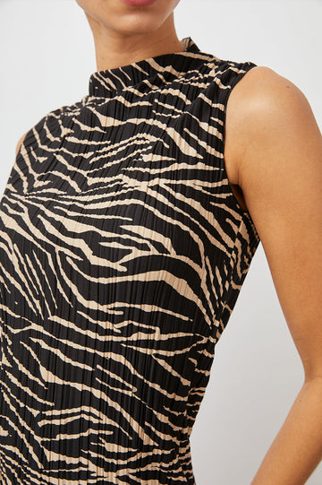 Wakely Sleeveless Midi Dress with Pleated Fabric and a Mock Neck in Cairo Colorway, a Black and Tan Tiger Print - Front View Featured on Model 
